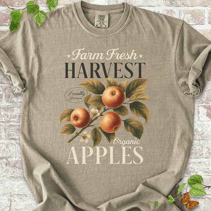 Harvest Apples T-shirt on Comfort Colors™ Khaki – features a cozy harvest graphic with detailed apple artwork and text reading “Locally Grown Organic Apples”