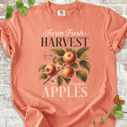Harvest Apples T-shirt on Comfort Colors™ Terracotta – features hand-drawn apples with rich green leaves and delicate white flowers under rustic typography