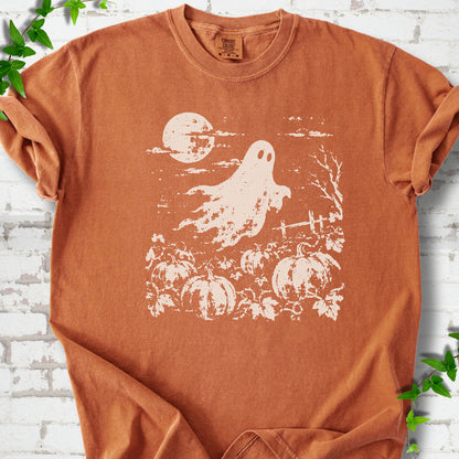 Yam Comfort Colors® T-shirt flat lay featuring a distressed ghost floating above a pumpkin patch beneath a full moon.