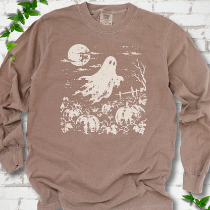Espresso Comfort Colors® long sleeve tee flat lay featuring a distressed ghost floating above a pumpkin patch beneath a full moon.