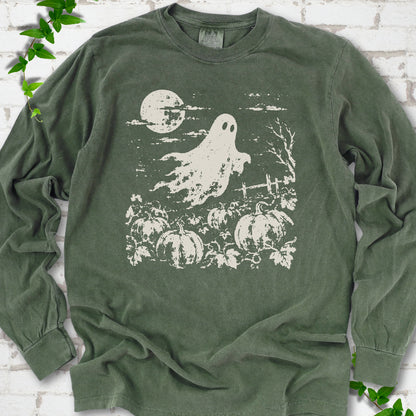 Hemp Comfort Colors® long sleeve tee flat lay featuring a distressed ghost floating above a pumpkin patch beneath a full moon.
