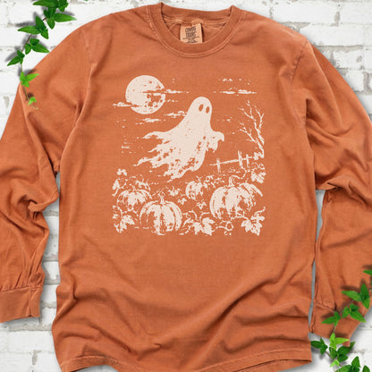 Yam Comfort Colors® long sleeve tee flat lay featuring a distressed ghost floating above a pumpkin patch beneath a full moon.
