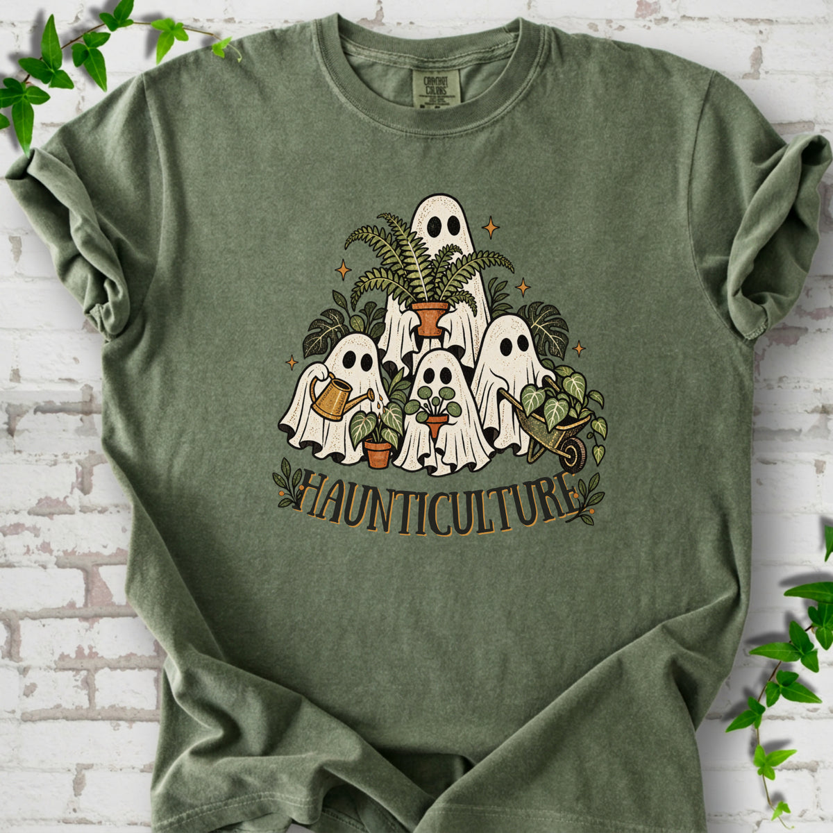 Moss Comfort Colors® T-shirt featuring four friendly gardening ghosts with houseplants and the word Haunticulture