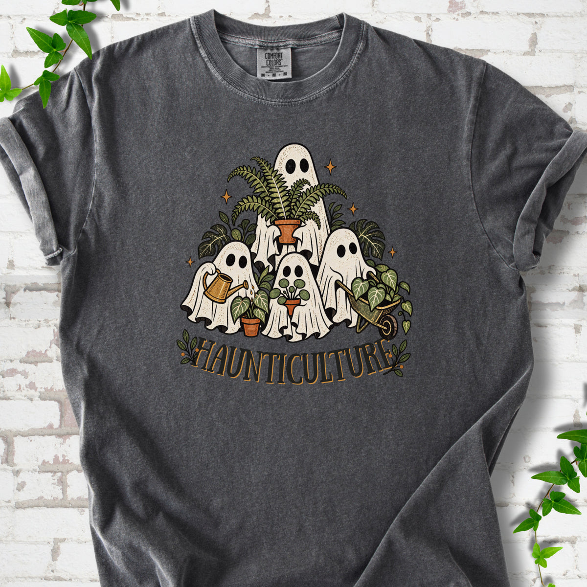 Pepper Comfort Colors® T-shirt featuring four friendly gardening ghosts with houseplants and the word Haunticulture
