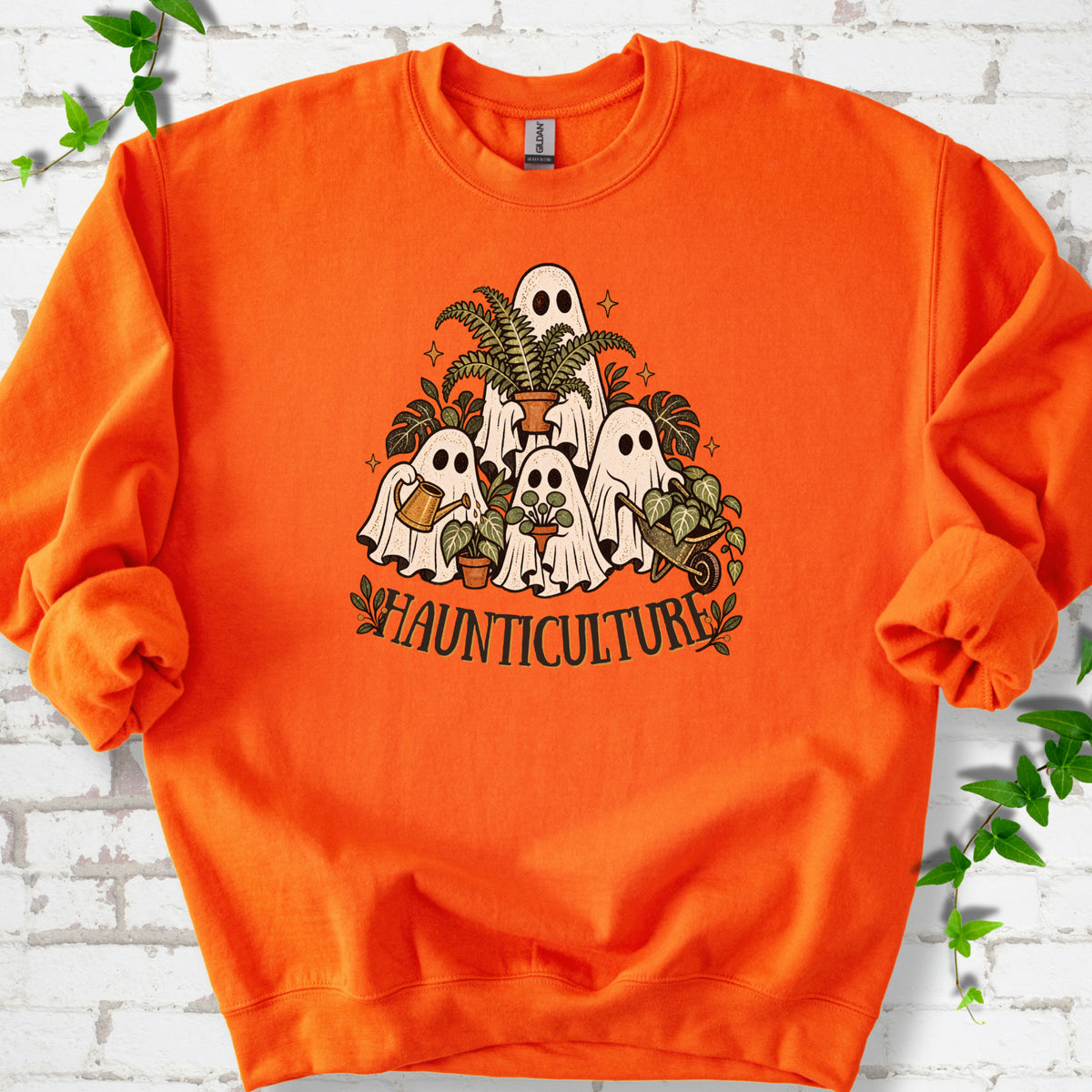 Orange Gildan® 18000 crewneck sweatshirt featuring four friendly gardening ghosts with houseplants and the word Haunticulture