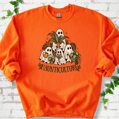 Orange Gildan® 18000 crewneck sweatshirt featuring four friendly gardening ghosts with houseplants and the word Haunticulture