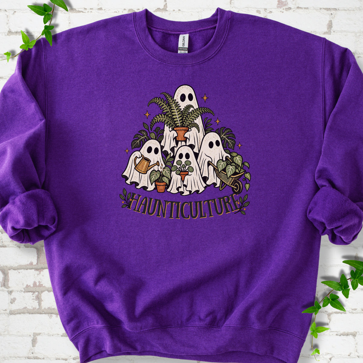 Purple Gildan® 18000 crewneck sweatshirt featuring four friendly gardening ghosts with houseplants and the word Haunticulture
