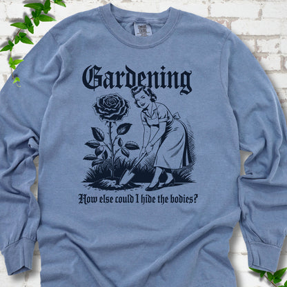 Blue Jean Comfort Colors® long sleeve T-shirt flat lay with black Hide the Bodies retro gardening artwork.