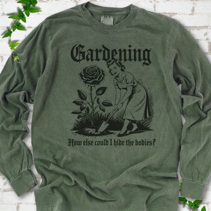 Hemp Comfort Colors® long sleeve T-shirt flat lay with black Hide the Bodies retro gardening artwork.