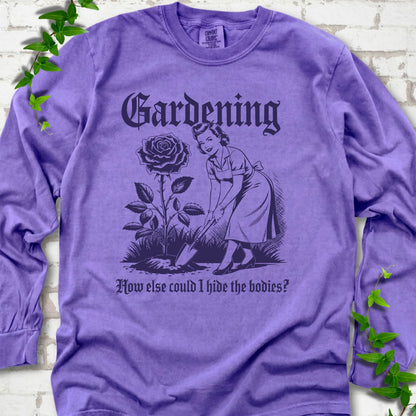 Violet Comfort Colors® long sleeve T-shirt flat lay with black Hide the Bodies retro gardening artwork.