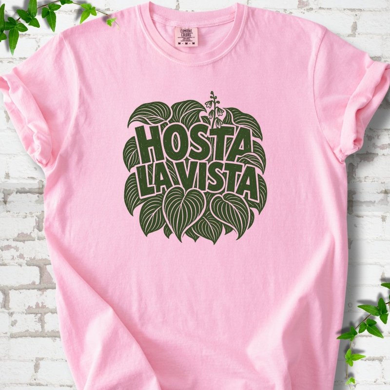 Blossom Comfort Colors® T-shirt with distressed dark green Hosta La Vista lettering surrounded by hosta leaves