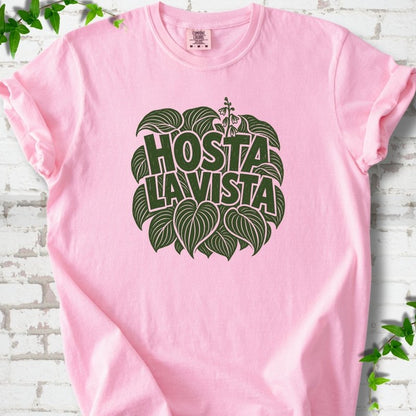 Blossom Comfort Colors® T-shirt with distressed dark green Hosta La Vista lettering surrounded by hosta leaves