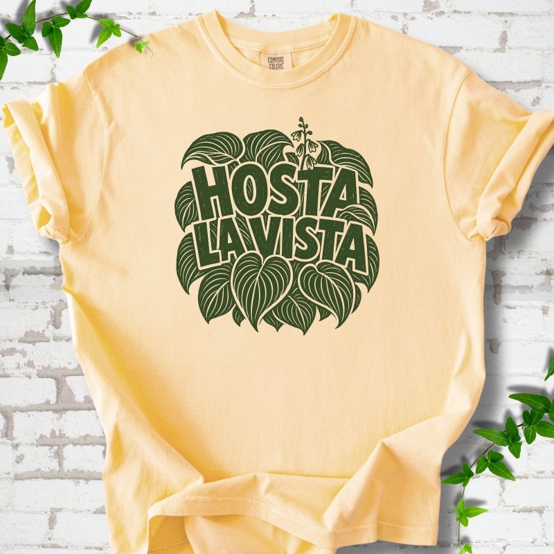 Butter Comfort Colors® T-shirt with distressed dark green Hosta La Vista lettering surrounded by hosta leaves