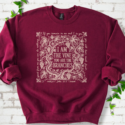 Maroon Gildan® 18000 crewneck sweatshirt flat lay featuring John 15:5 text framed by grapevines.