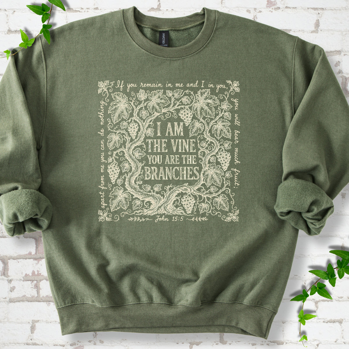 Military Green Gildan® 18000 crewneck sweatshirt flat lay featuring John 15:5 text framed by grapevines.