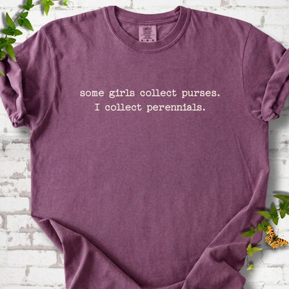 Berry Comfort Colors® T-shirt front mockup featuring Cream typewriter-style text reads “some girls collect purses. I collect perennials.” in a centered two-line layout.