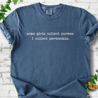 Denim Comfort Colors® T-shirt front mockup featuring Cream typewriter-style text reads “some girls collect purses. I collect perennials.” in a centered two-line layout.