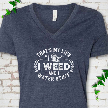 Heather Navy Bella Canvas® V-neck T-shirt flat lay featuring That's My Life I Weed and I Water Stuff text with a watering can and garden tools.