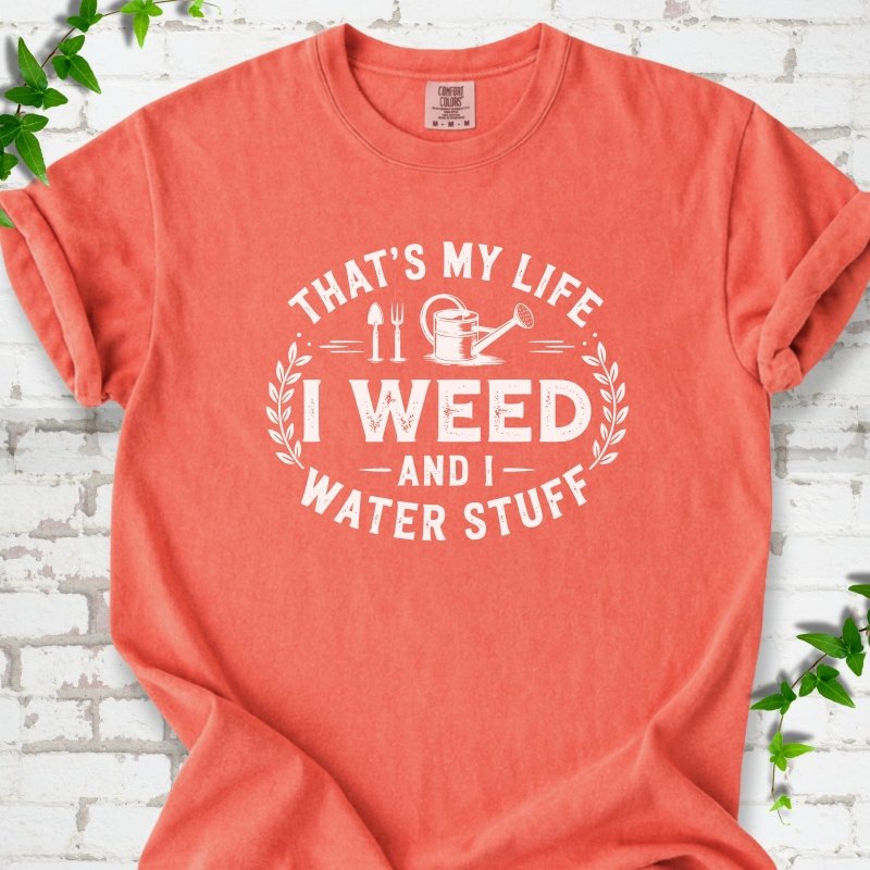 Bright Salmon Comfort Colors® T-shirt flat lay featuring That's My Life I Weed and I Water Stuff text with a watering can and garden tools.