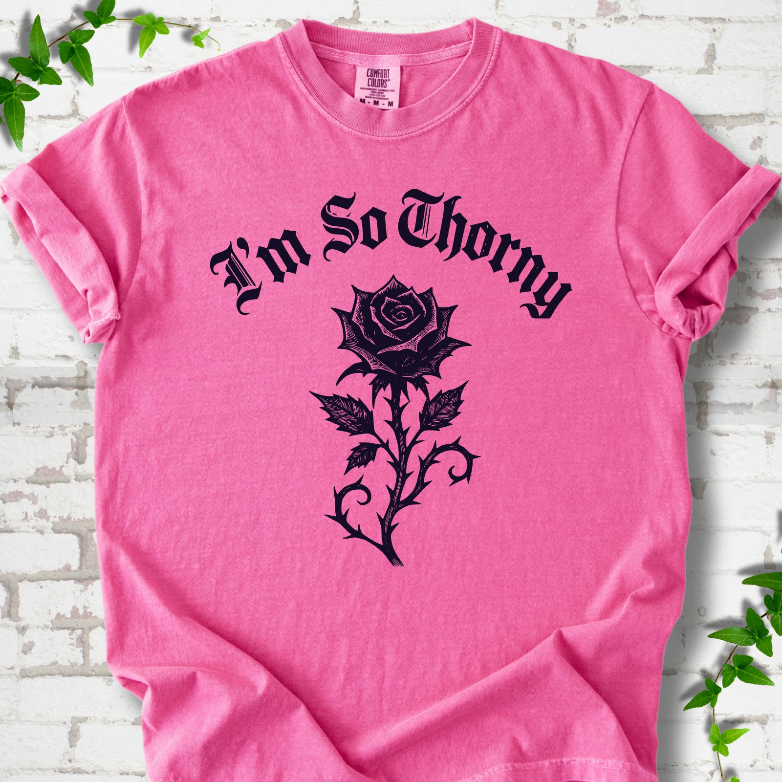 Crunchberry Comfort Colors® T-shirt flat lay with a distressed Gothic blackletter I'm So Thorny rose design.