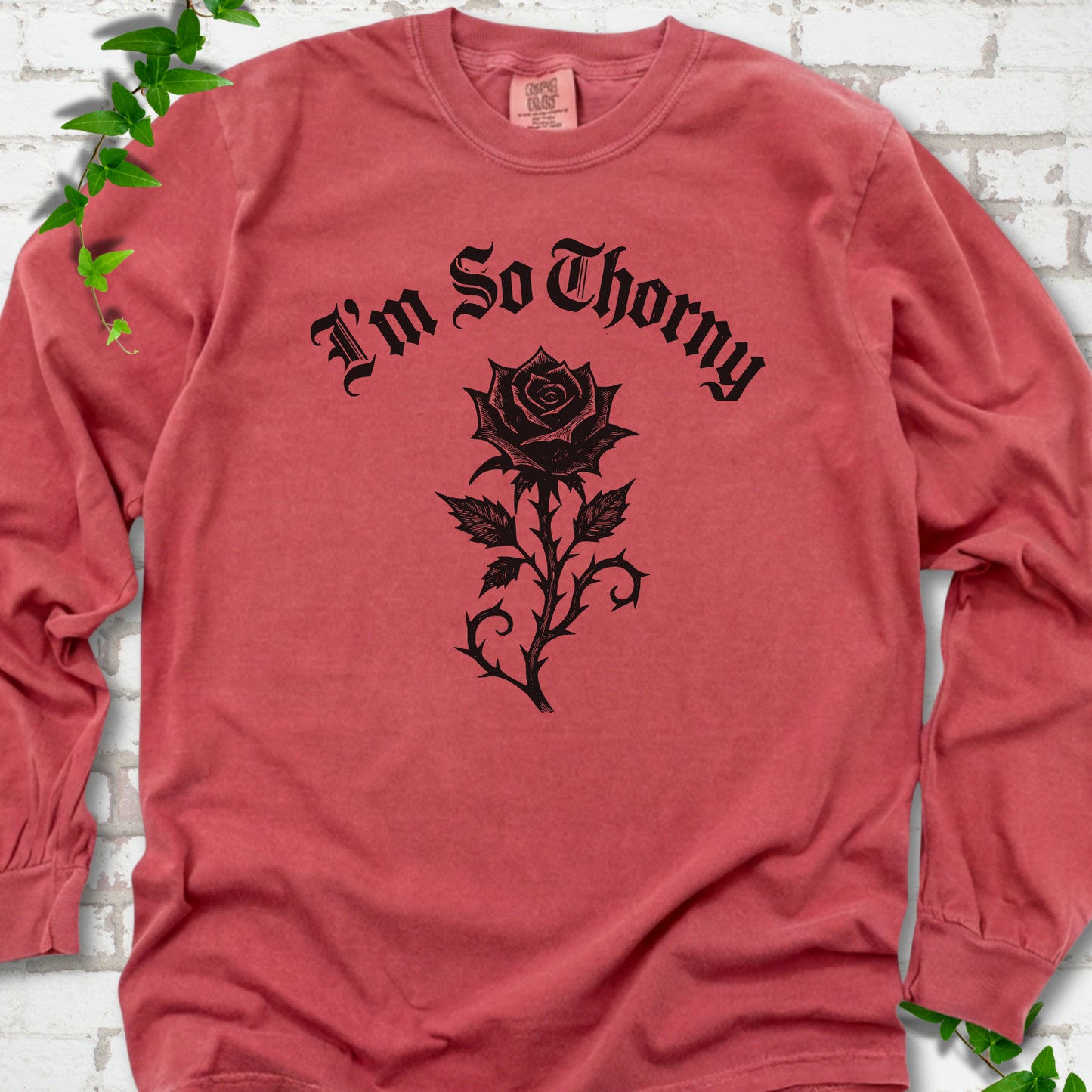 Crimson Comfort Colors® long sleeve T-shirt flat lay with a distressed Gothic blackletter I'm So Thorny rose design.
