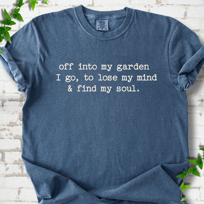 Denim Comfort Colors® short sleeve T-shirt flat lay with white text reading "Off into my garden I go, to lose my mind and find my soul"
