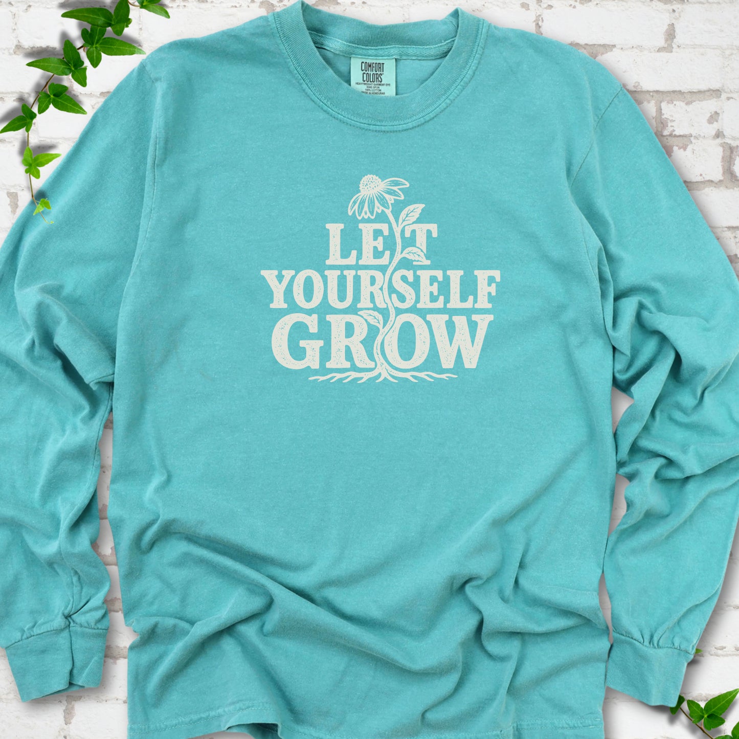 Seafoam Comfort Colors® long sleeve T-shirt with distressed Let Yourself Grow flower graphic
