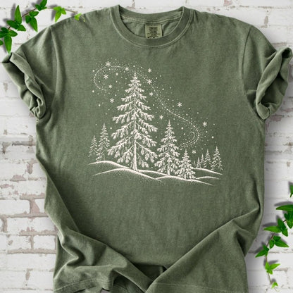 Moss Comfort Colors T-shirt flat lay with white snow-covered spruce and pine forest design