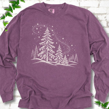 Berry Comfort Colors long sleeve T-shirt flat lay with white snow-covered spruce and pine forest design