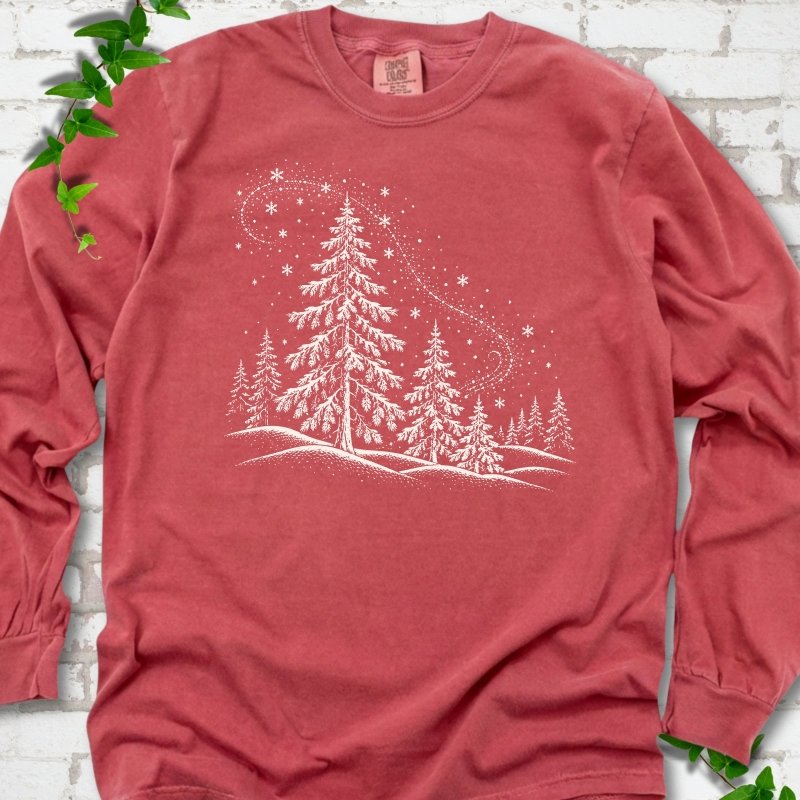 Crimson Comfort Colors long sleeve T-shirt flat lay with white snow-covered spruce and pine forest design