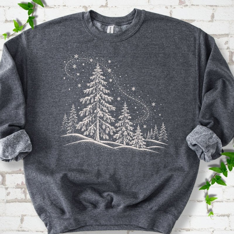 Dark Heather sweatshirt flat lay with white snow-covered spruce and pine forest design