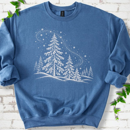 Indigo Blue sweatshirt flat lay with white snow-covered spruce and pine forest design