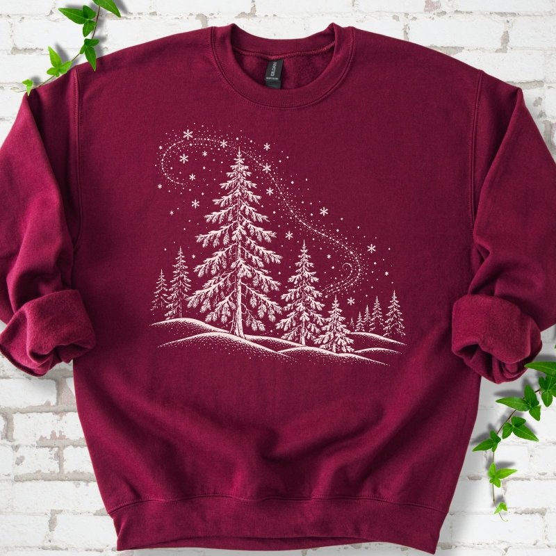 Maroon sweatshirt flat lay with white snow-covered spruce and pine forest design