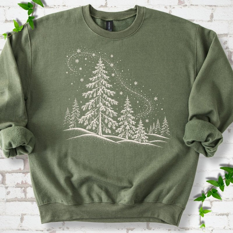 Military Green sweatshirt flat lay with white snow-covered spruce and pine forest design