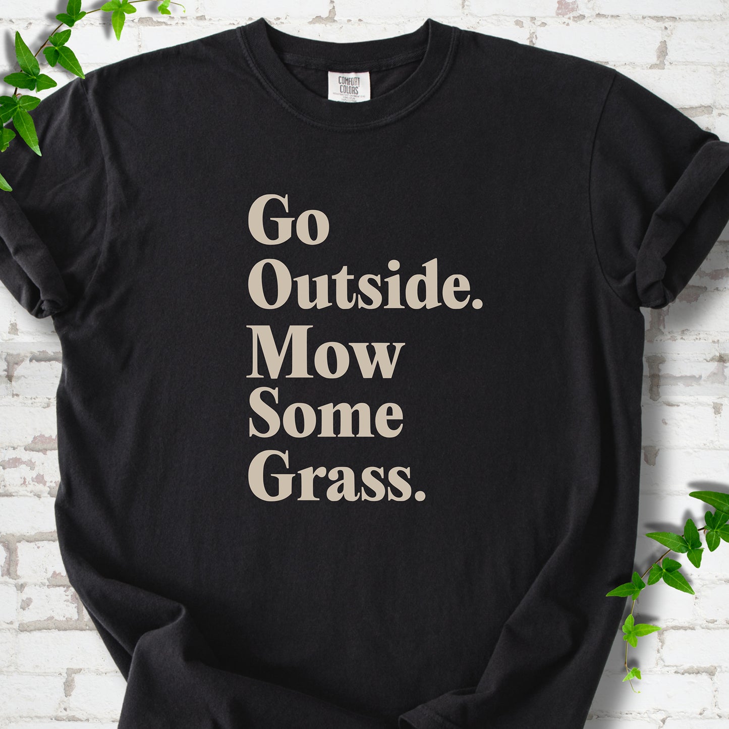 Black Comfort Colors® T-shirt with cream Go Outside. Mow Some Grass. slogan
