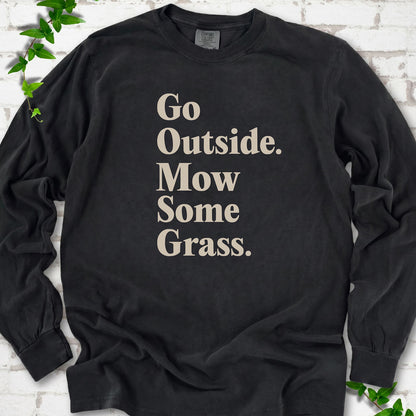 Black Comfort Colors® long sleeve T-shirt with cream Go Outside. Mow Some Grass. slogan