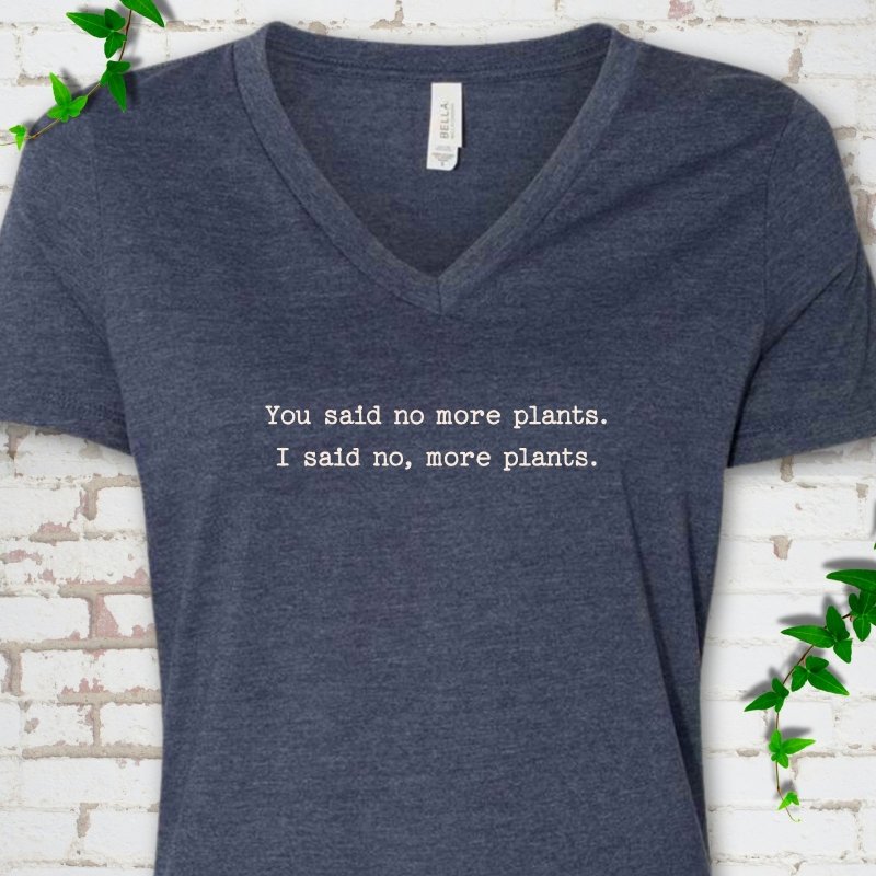 Heather Navy Bella Canvas® V-neck T-shirt flat lay featuring the words You said no more plants. I said no, more plants.