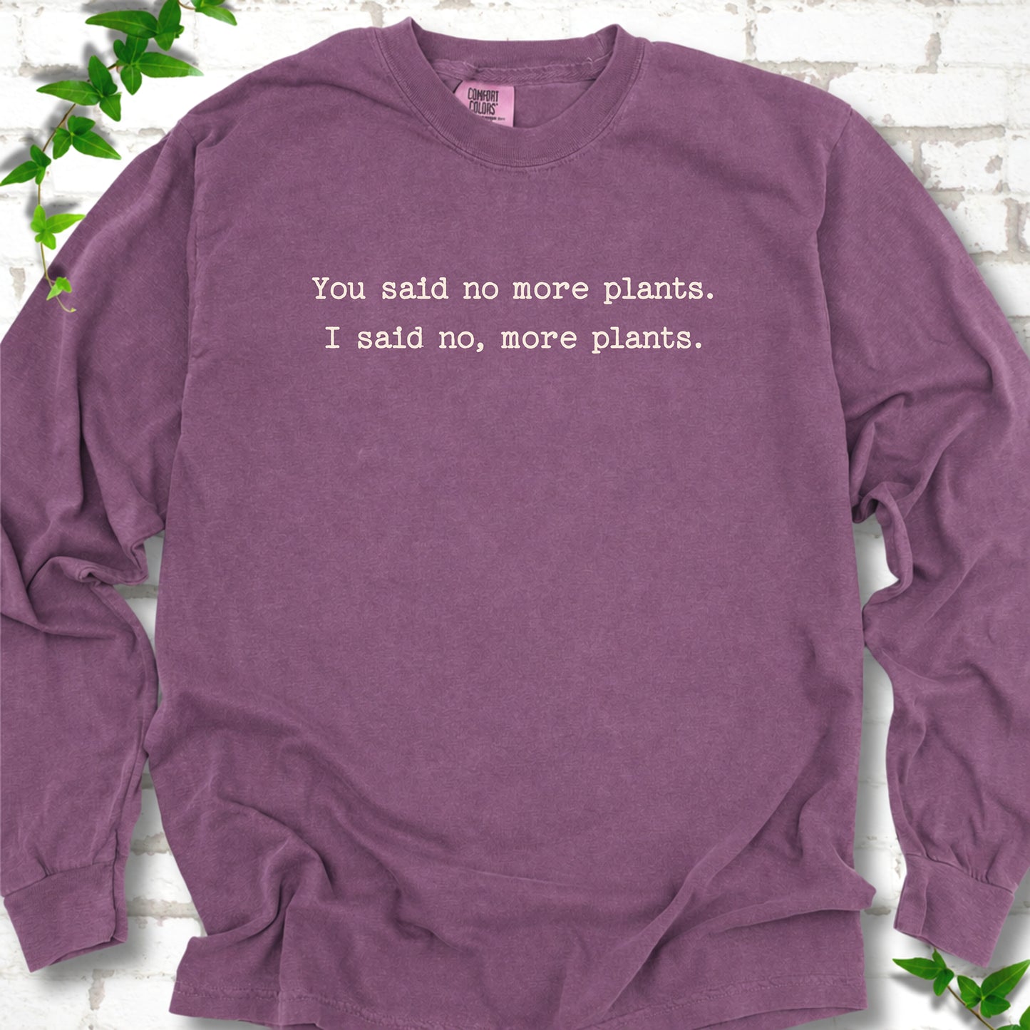 Berry Comfort Colors® long sleeve T-shirt flat lay featuring the words You said no more plants. I said no, more plants.