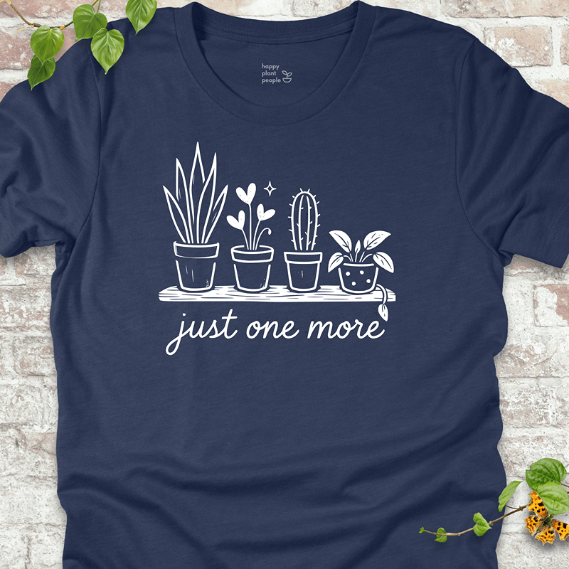 Lightweight houseplant-themed tee with minimalist plant graphics on a dark blue shirt