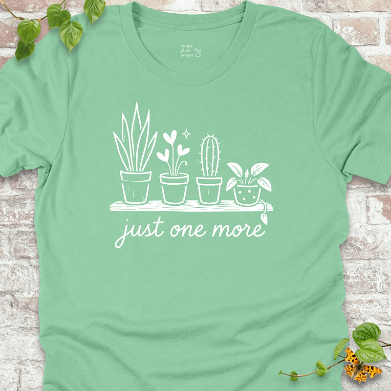 Light and breathable tee for houseplant hoarders, featuring potted plant line art on a pastel green shirt