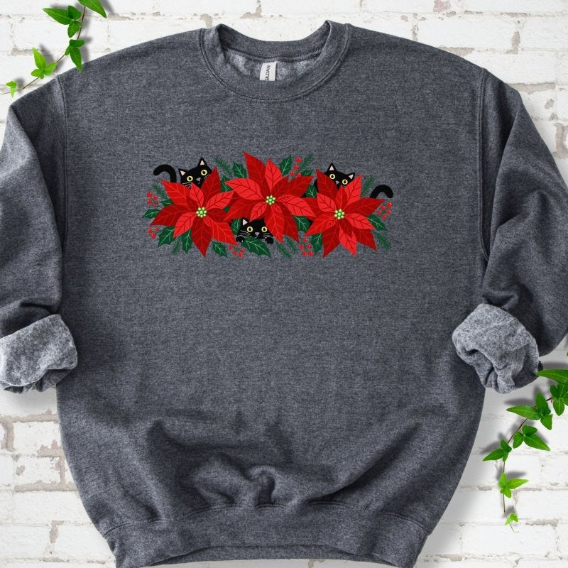 Dark Heather classic sweatshirt shown flat with black cats peeking through red poinsettias and holiday greenery