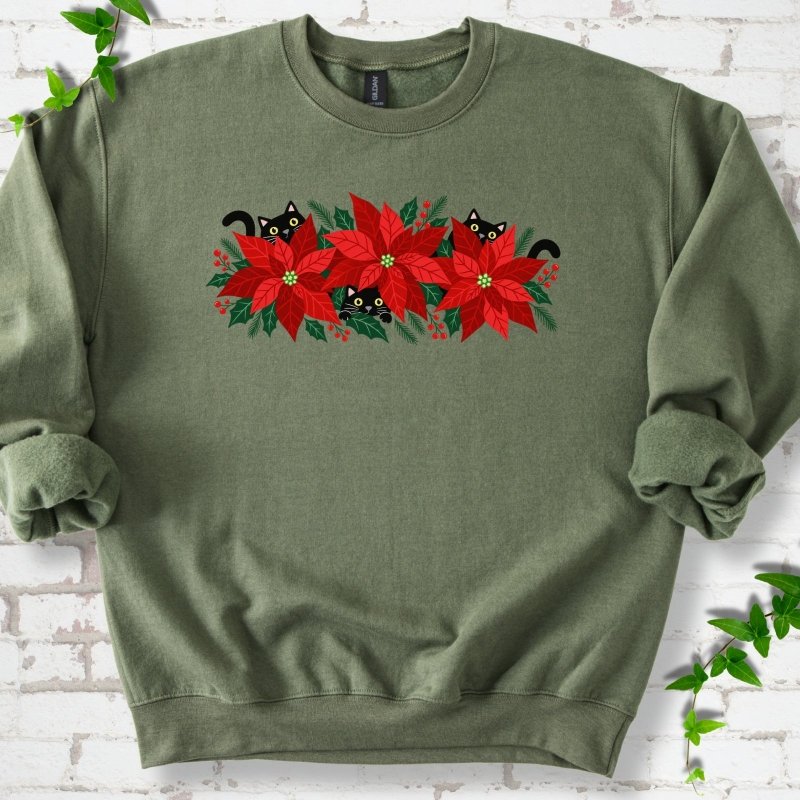 Military Green classic sweatshirt shown flat with black cats peeking through red poinsettias and holiday greenery