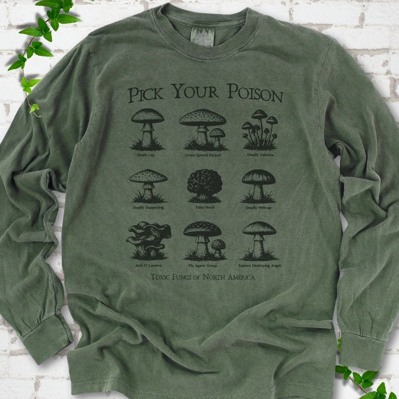 Hemp Comfort Colors® long sleeve T-shirt flat lay featuring a Pick Your Poison field guide of toxic North American mushrooms.