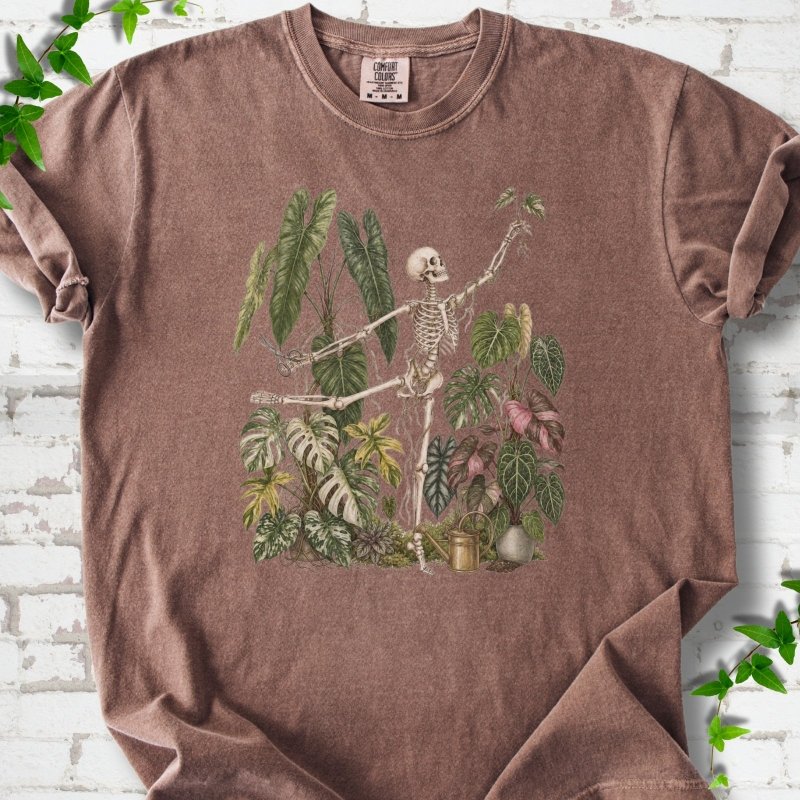 Espresso Comfort Colors® T-shirt front mockup featuring a skeleton tending a collection of leafy houseplants.