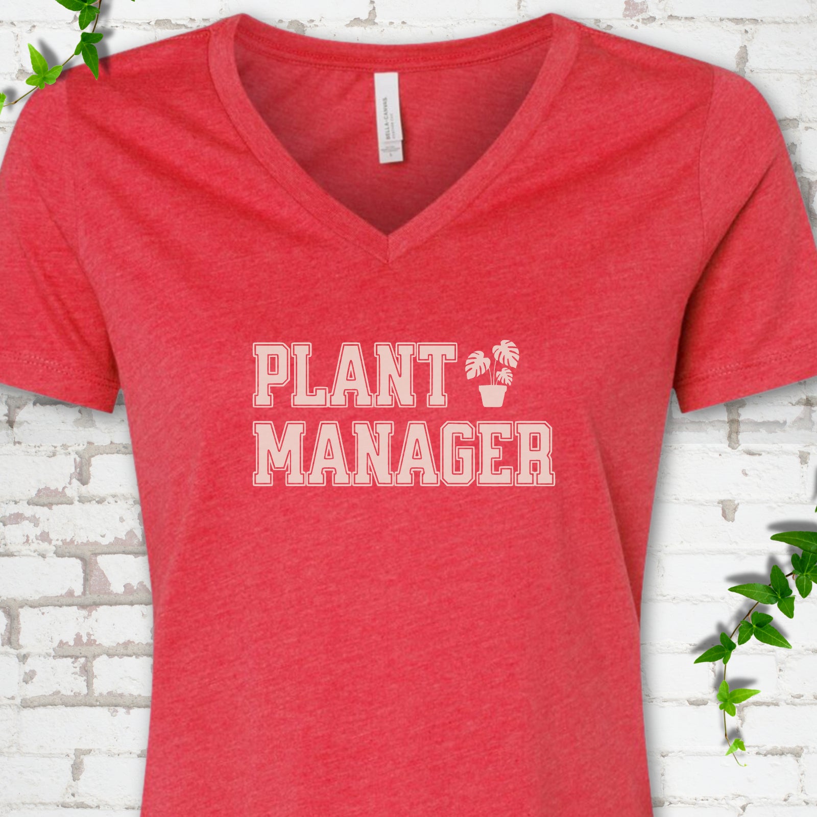 Heather Red Bella Canvas® V-neck T-shirt front mockup featuring the collegiate Plant Manager design with a potted monstera.