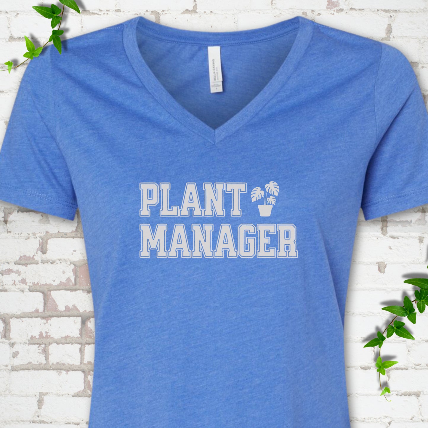 Heather True Royal Bella Canvas® V-neck T-shirt front mockup featuring the collegiate Plant Manager design with a potted monstera.