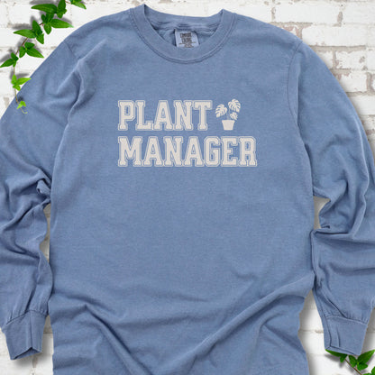 Blue Jean Comfort Colors® long sleeve T-shirt front mockup featuring the collegiate Plant Manager design with a potted monstera.