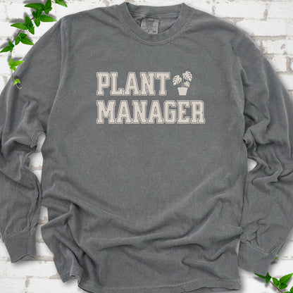 Pepper Comfort Colors® long sleeve T-shirt front mockup featuring the collegiate Plant Manager design with a potted monstera.