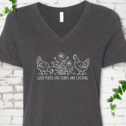Dark Grey Heather women's V-neck T-shirt flat lay with white line-art hens and flowers above the words "Good People Love Plants and Chickens."