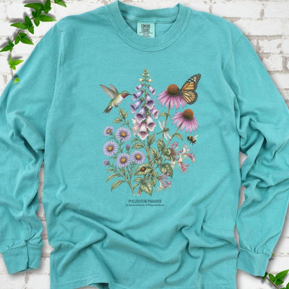 Seafoam Comfort Colors® long sleeve T-shirt flat lay featuring a hummingbird, monarch butterfly and bee among foxglove, coneflowers and asters with Pollinator Paradise text.
